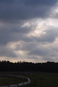 Corpuscular rays through the clouds above the track