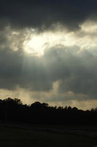 Corpuscular rays through the clouds above the track