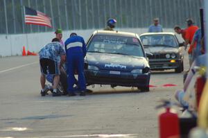 Mayhem Racing Honda Civic and North Loop Motorsports 2 BMW 325 in the pits