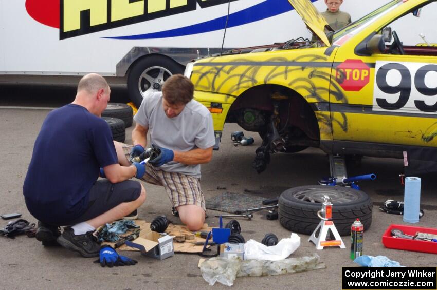 Team Short Bus VW Golf GL has an extended stay behind the pit wall for repairs