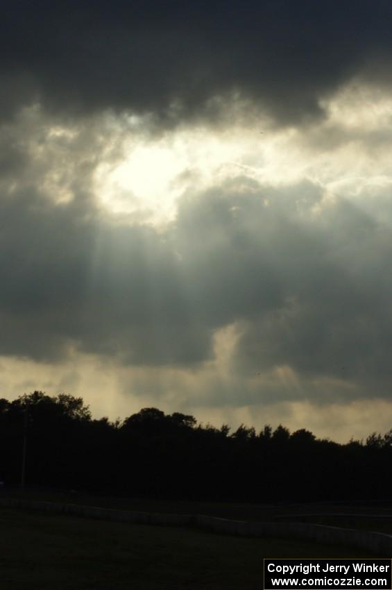 Corpuscular rays through the clouds above the track