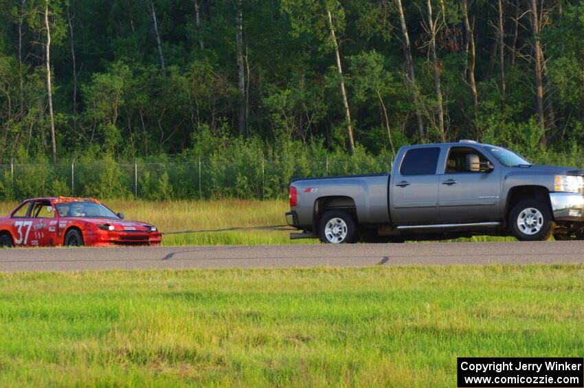 Trump Chump Honda Prelude gets pulled back onto the track after going off at turn 2