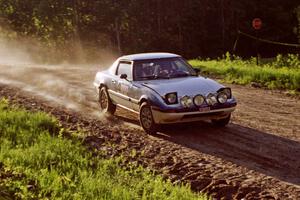 Mike Hurst / Rob Bohn take it easy at the crest of the crossroads in their Mazda RX-7.