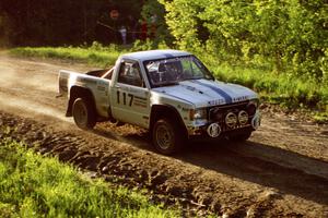 Ken Stewart / Doc Shrader cruise by at speed over the crest of the crossroads in their Chevy S-10.