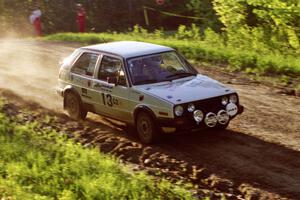 Wayne Prochaska / Annette Prochaska take the crest of the crossroads at speed in their VW Golf.