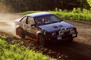 Lynn Dillon / Mark Rinkel at speed over the crossroads crest in their Pontiac Sunbird.