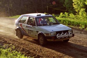 Art Burmeister / Eric Burmeister at speed at the crossroads spectator location in their VW GTI.
