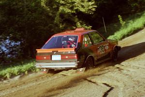 Jim Buchwitz / C.O. Rudstrom in their Mercury Lynx just after the crest at the crossroads.