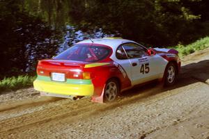 Miroslaw Babinski / Piotr Modrzejewski at speed just beyond the crossroads in their Toyota Celica All-trac.