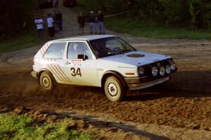 Doug Davenport / Al Kintigh drift their VW Golf uphill at the spectator location at the crossroads.