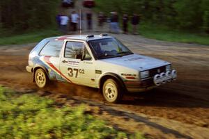 Art Burmeister / Eric Burmeister head uphill at the crossroads spectator location in their VW GTI.