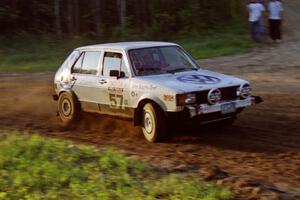 Damien Crane / John Adams-Graf drift through the crossroads uphill sweeper in their VW Rabbit.