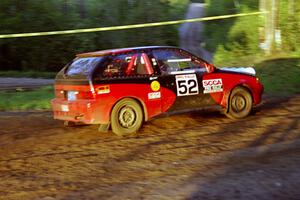 Kurt Winkelmann / Tom Sherony head through an uphill sweeper in their Suzuki Swift at the crossroads.