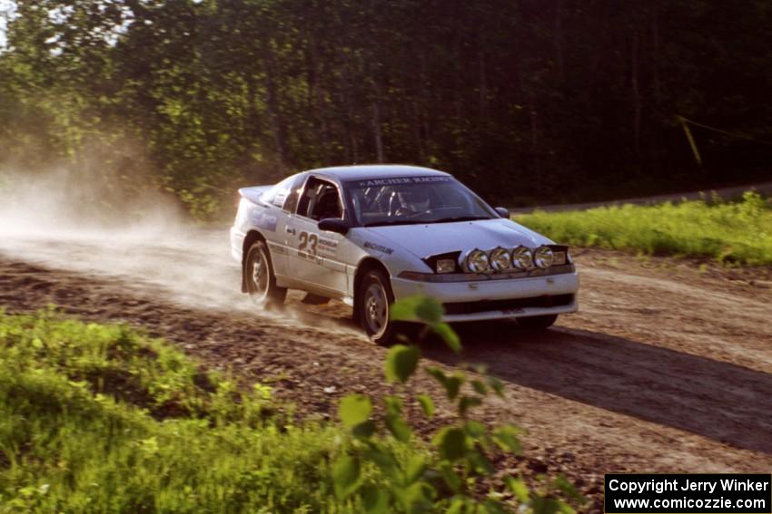 Chris Czyzio / Eric Carlson at speed over the crest at the crossroads in their Mitsubishi Eclipse GSX.
