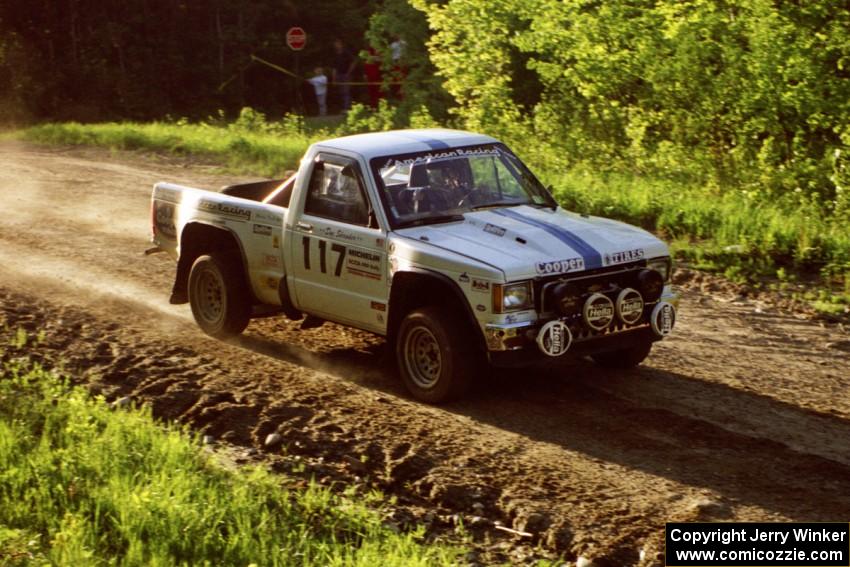 Ken Stewart / Doc Shrader cruise by at speed over the crest of the crossroads in their Chevy S-10.
