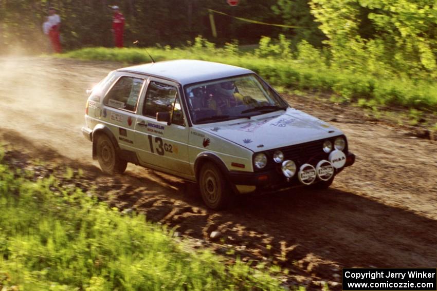 Wayne Prochaska / Annette Prochaska take the crest of the crossroads at speed in their VW Golf.