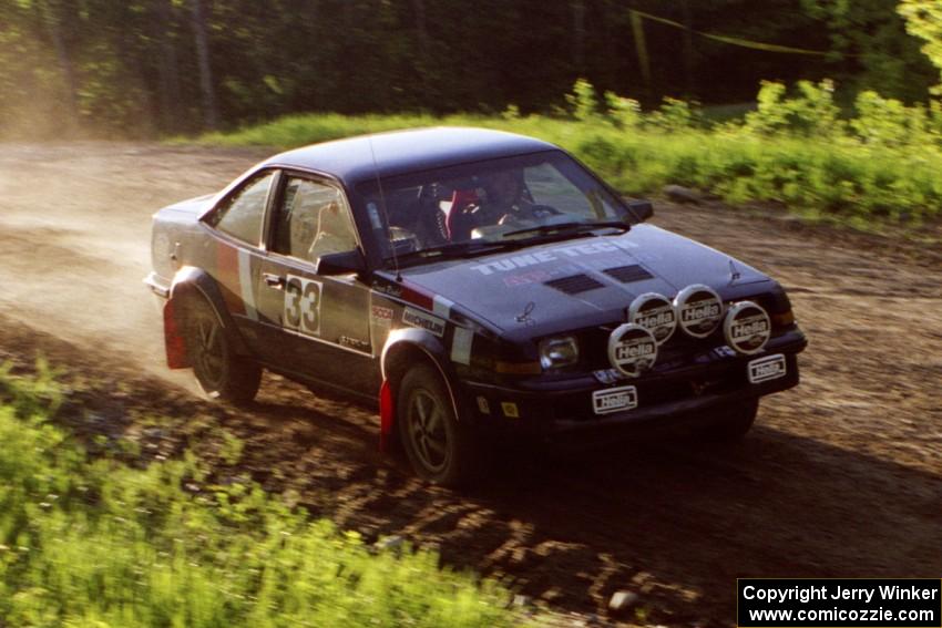 Lynn Dillon / Mark Rinkel at speed over the crossroads crest in their Pontiac Sunbird.