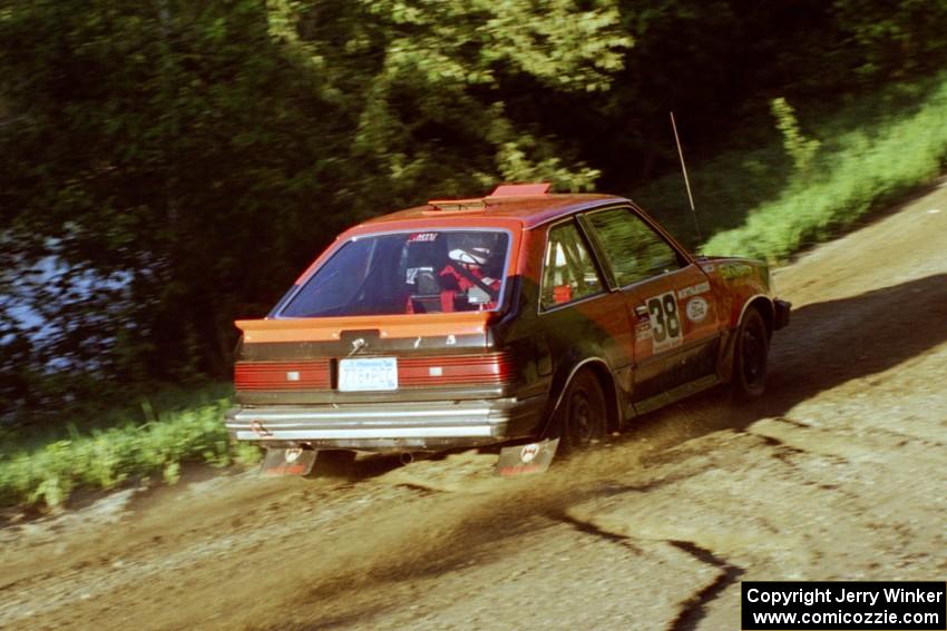Jim Buchwitz / C.O. Rudstrom in their Mercury Lynx just after the crest at the crossroads.