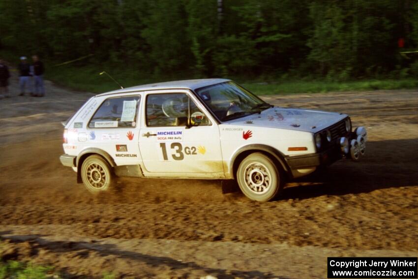 Wayne Prochaska / Annette Prochaska take an uphill sweeper at the crossroads in their VW Golf.