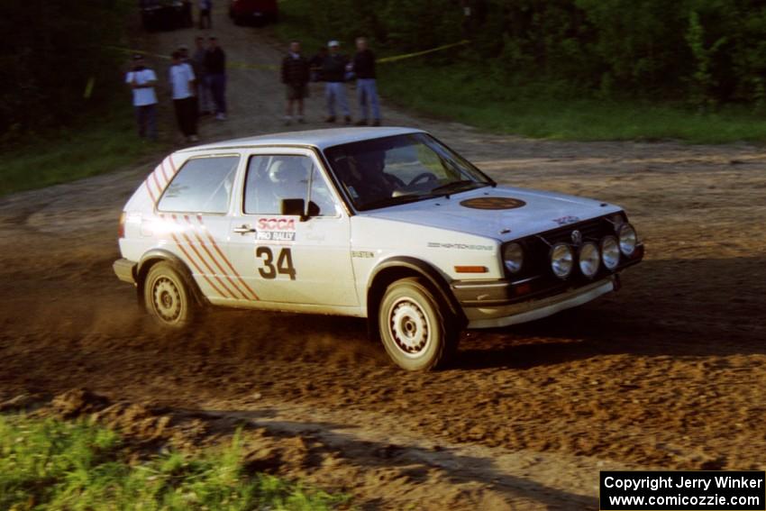 Doug Davenport / Al Kintigh drift their VW Golf uphill at the spectator location at the crossroads.