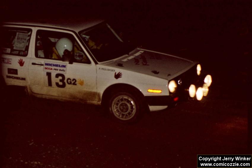 Wayne Prochaska / Annette Prochaska drive through the crossroads at night in their VW Golf.