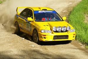 Al Kintigh / Heidi Meyers Subaru Impreza at speed through a sweeper on SS1.