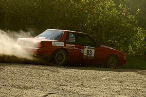 Mark Utecht / Rob Bohn Ford Mustang drifts through a 90-left on SS2.