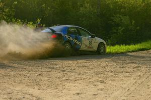 Paul Dunn / Kim DeMotte drift their Dodge SRT-4 through a 90-left on SS2.