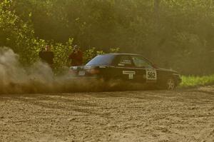 Brian Dondlinger / Dave Parps drift through a dusty sweeping left on SS2 in their Nissan Sentra SE-R.