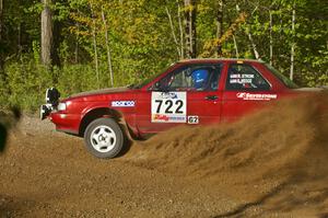 Rob Stroik / Ross Wegge spray gravel at a 90-left on SS2 in their ex-Jake Himes Nissan Sentra SE-R.