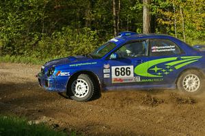 The Subaru WRX of Heath Nunnemacher / Heidi Nunnemacher drifts hard on SS2.