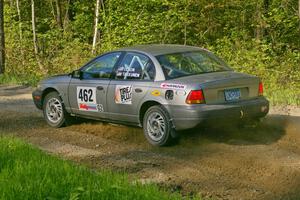 Mike Olson / Jason Takkunen rocket out of a left-hander on SS2 in their Saturn SL2.