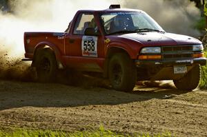 Jim Cox / Scott Parrott blast onto Parkway Forest Road on SS4 in their Chevy S-10.