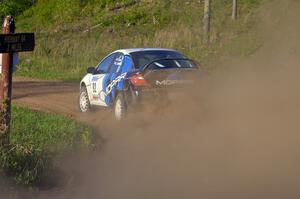 Paul Dunn / Kim DeMotte accelerate out of a left-hander on SS4 in their Dodge SRT-4.