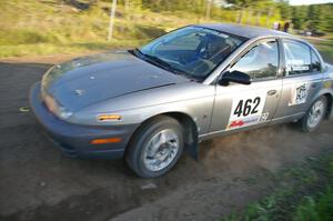 Mike Olson / Jason Takkunen make a hard left onto Parkway Forest Road on SS4 in their Saturn SL2.