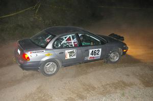 Mike Olson / Jason Takkunen set up for a downhill right on SS5 in their Saturn SL2.