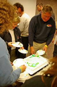 Heidi Meyers and J.B. Niday share wedding cake with Headwaters workers after the event.