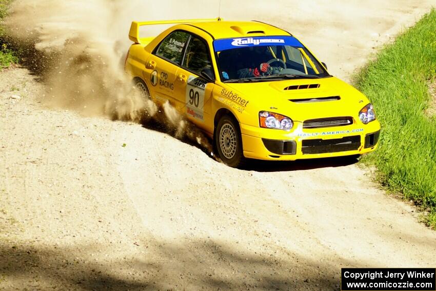 In preparation for STPR, Lauchlin O'Sullivan / Scott Putnam wrung out their Subaru WRX STi seen here at a sweeper on SS1.