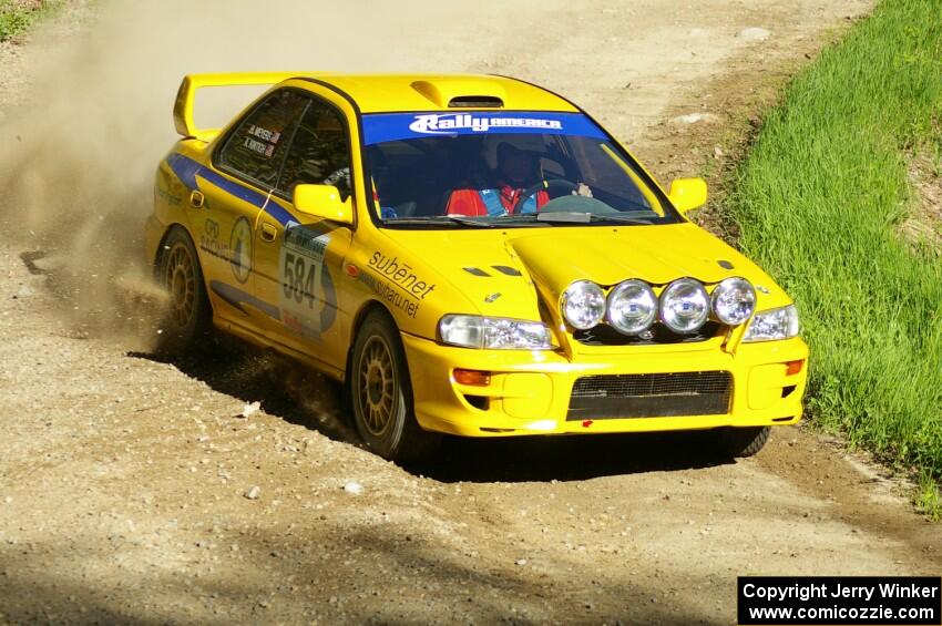 Al Kintigh / Heidi Meyers Subaru Impreza at speed through a sweeper on SS1.