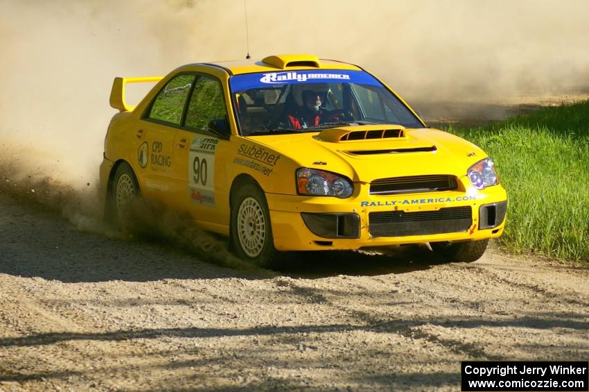 Lauchlin O'Sullivan / Scott Putnam blast out of a 90-left on SS2 in their Subaru WRX STi.