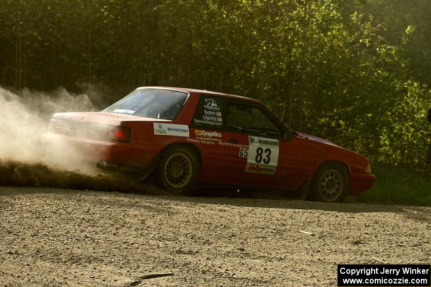 Mark Utecht / Rob Bohn Ford Mustang drifts through a 90-left on SS2.