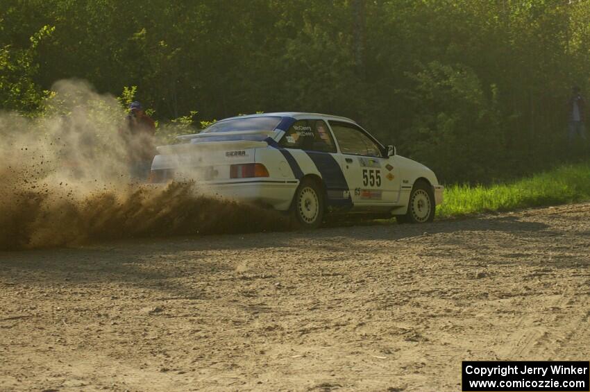 Colin McCleery / Nancy McCleery drift through a 90-left in their Ford Sierra XR8 on SS2.