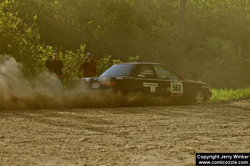Brian Dondlinger / Dave Parps drift through a dusty sweeping left on SS2 in their Nissan Sentra SE-R.