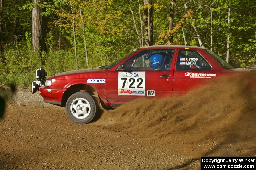 Rob Stroik / Ross Wegge spray gravel at a 90-left on SS2 in their ex-Jake Himes Nissan Sentra SE-R.