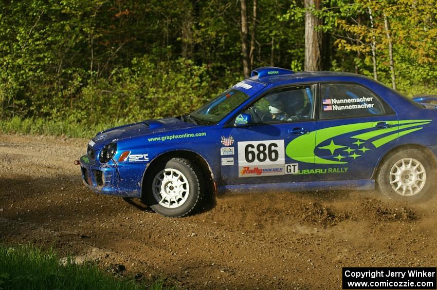 The Subaru WRX of Heath Nunnemacher / Heidi Nunnemacher drifts hard on SS2.