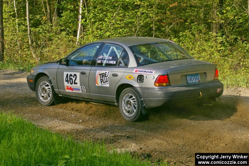 Mike Olson / Jason Takkunen rocket out of a left-hander on SS2 in their Saturn SL2.