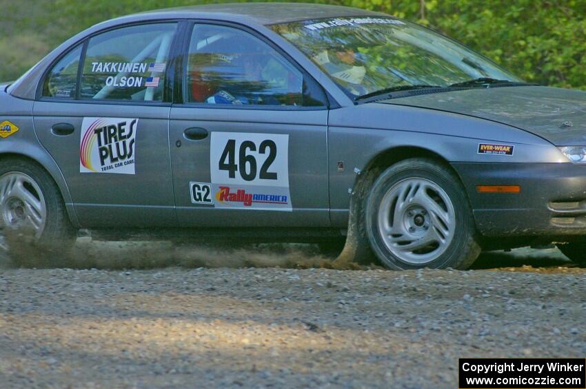 Mike Olson / Jason Takkunen set up for a hairpin on SS3 in their Saturn SL2.
