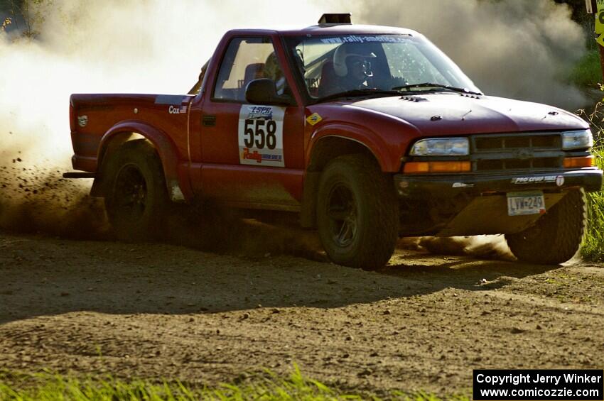 Jim Cox / Scott Parrott blast onto Parkway Forest Road on SS4 in their Chevy S-10.