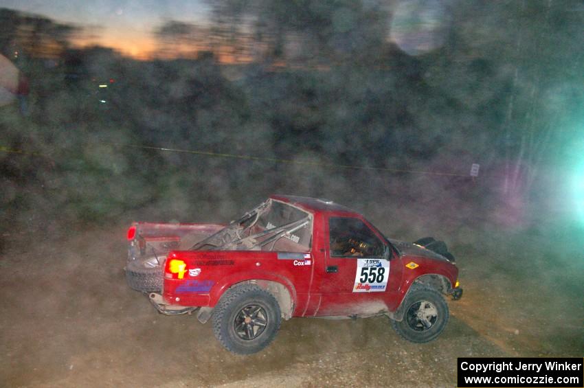 Jim Cox / Scott Parrott drive carefully through the dust at a downhill right on SS5 in their Chevy S-10.