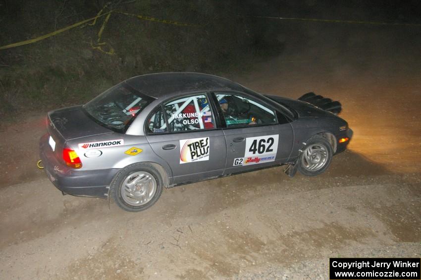 Mike Olson / Jason Takkunen set up for a downhill right on SS5 in their Saturn SL2.